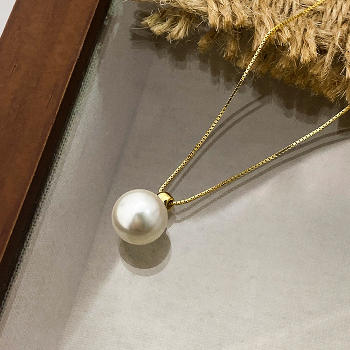Sterling silver pearl pendant necklace featuring a round pearl on a delicate chain, stylish jewelry by Plush Fashion Hub