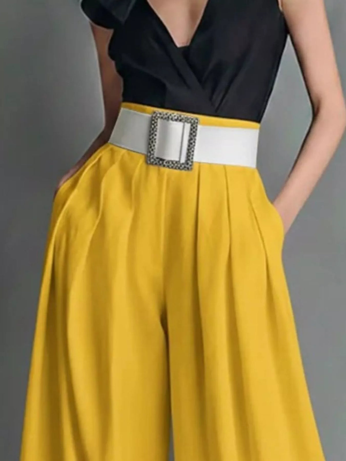 High-waisted wide-leg pants from Plush Fashion Hub displayed on a hanger, showing their flowy, relaxed fit and stylish silhouette.