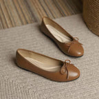 Women's FitiqueFit slip-on flats with egg-roll edge and round toe, inspired by classic Chanel-style footwear.