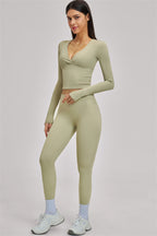 Fitglutes Activewear long sleeve crop top from The Swoon collection, showing a fitted black workout top with a high neckline.