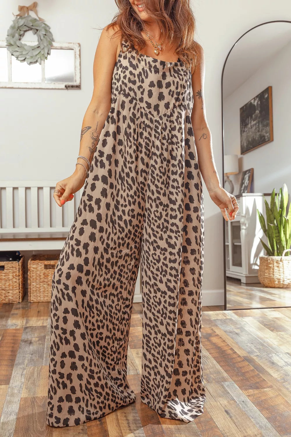Leopard print square neck pleated wide-leg jumpsuit from Plush Fashion Hub, featuring a stylish, flowy design and wide-leg silhouette.