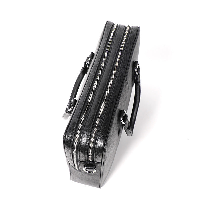 Men's leather briefcase by Plush Fashion Hub, large capacity cowhide handbag with horizontal design and sturdy handles.
