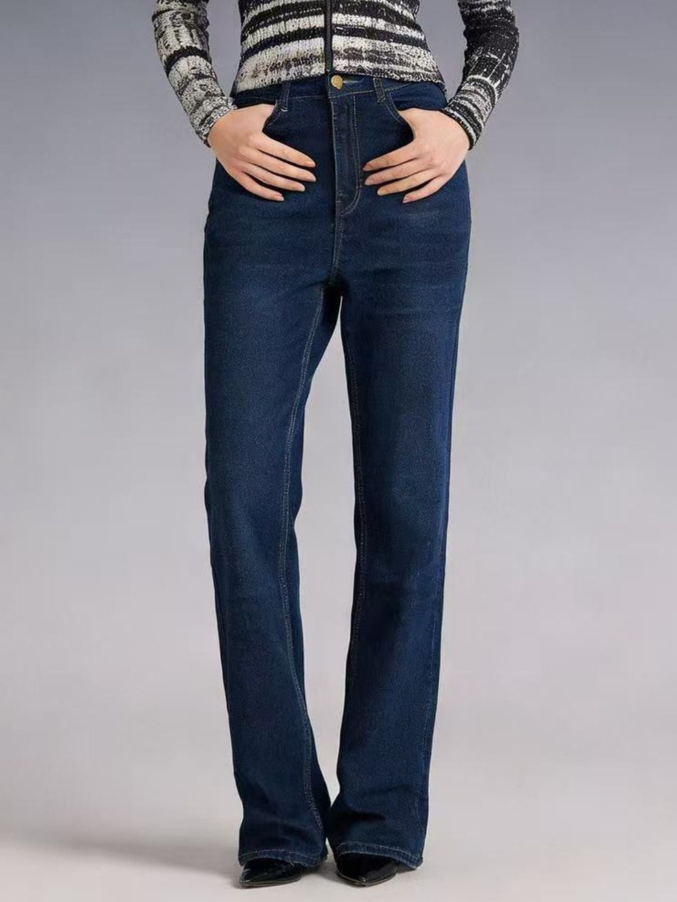 High-waisted bootcut denim jeans by Plush Fashion Shop, showcasing classic fit and dark wash fabric on a mannequin.