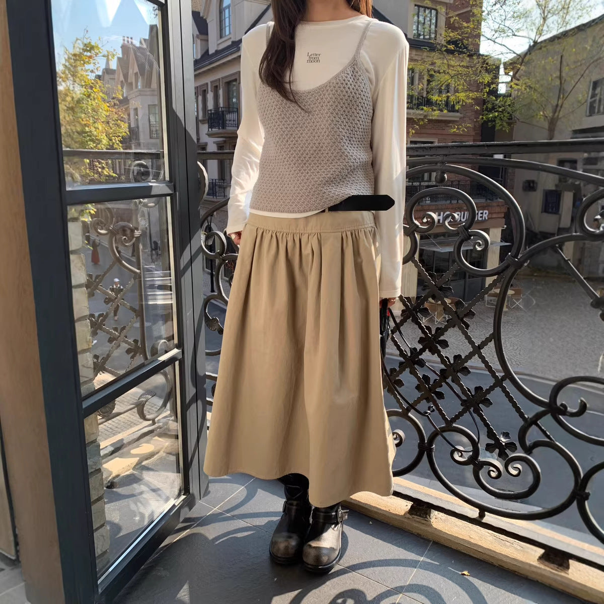FitiqueFit relaxed A-line cotton midi skirt with crushed pleats and belt, casualwear style, shown with a flowy silhouette and neutral color.