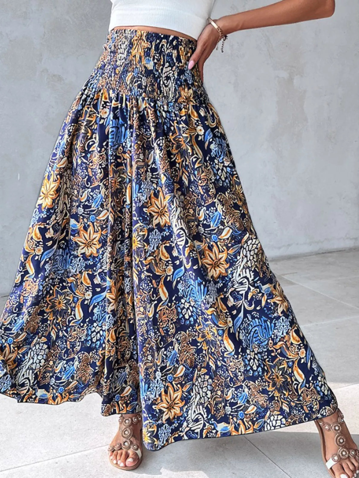 Printed wide-leg pants by Plush Fashion Hub, featuring a bold pattern and flowy fit, shown on a model.