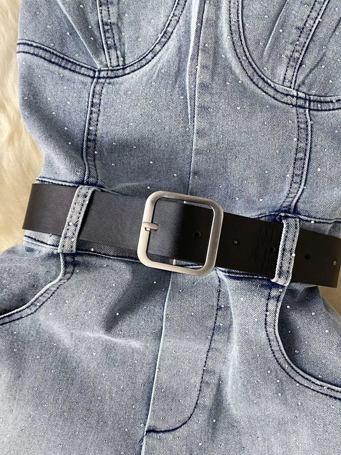 Plush Fashion Hub strapless denim romper with pockets, full-body suit featuring a fitted design and casual style.