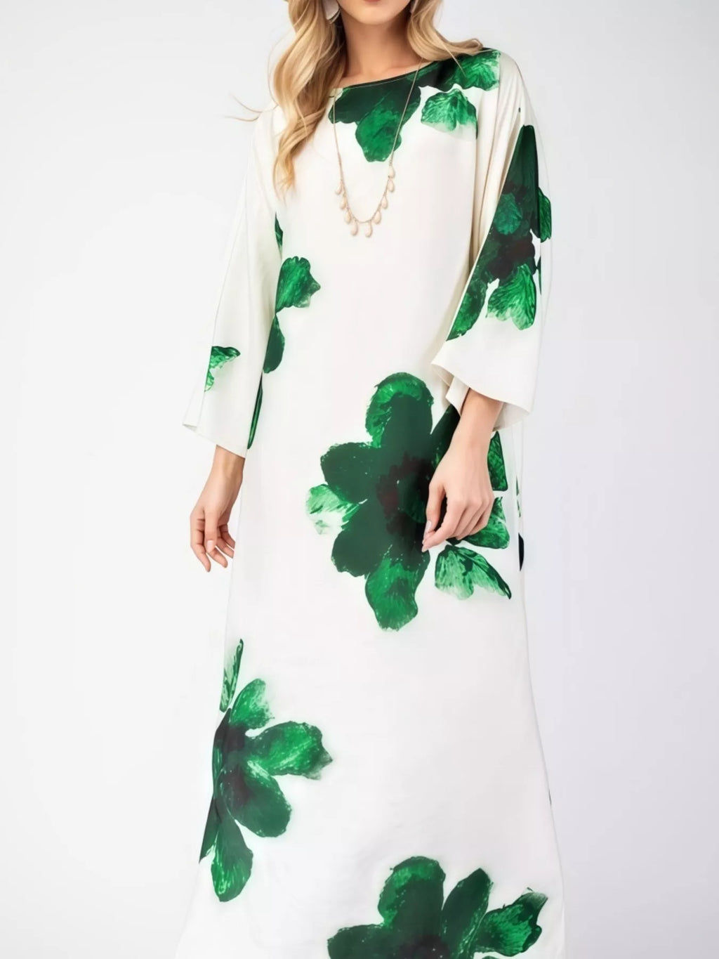 Floral print round neck dress by Trendsi featuring a flowy design and vibrant floral pattern on lightweight fabric.
