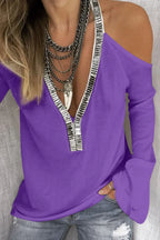 Sequin V-neck cold shoulder top from Trendsi featuring shimmering sequins and stylish cold shoulder design.