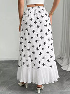 Flowy maxi skirt with bow print and ruffle hem from Trendsi, featuring lightweight fabric and a relaxed, feminine silhouette.