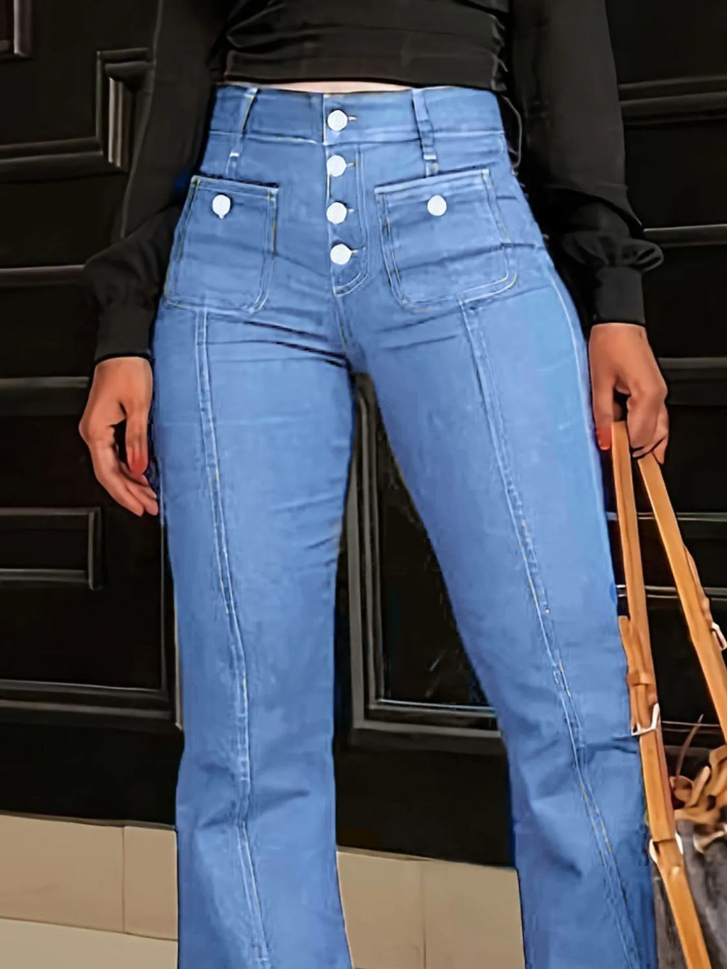 Plush Fashion Shop denim flare jeans with front and back pockets, showcasing a stylish, high-waisted design and classic denim texture.
