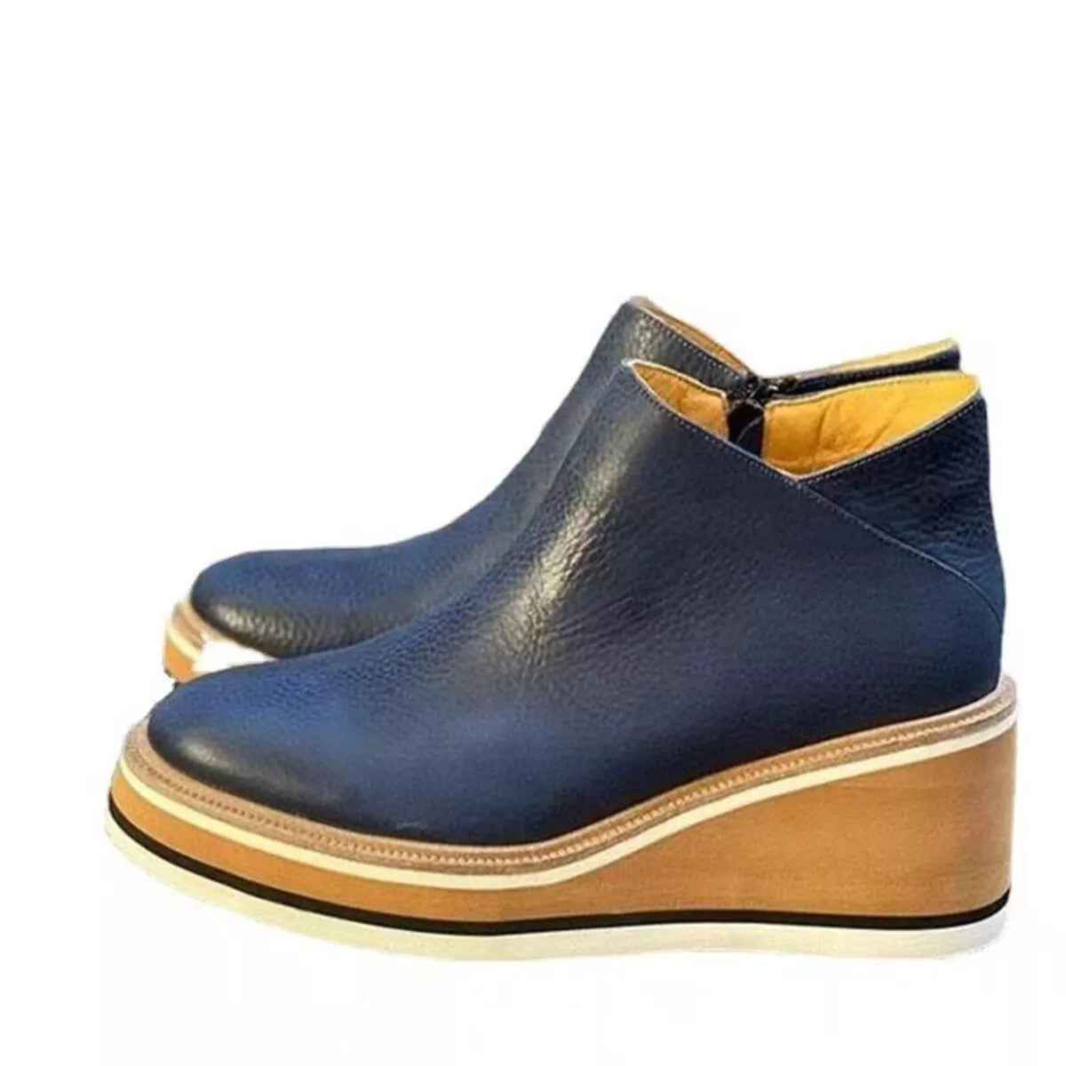 Women's ankle wedge boots with zipper, trendy and stylish Trendsi shoes featuring a comfortable wedge heel and sleek design.