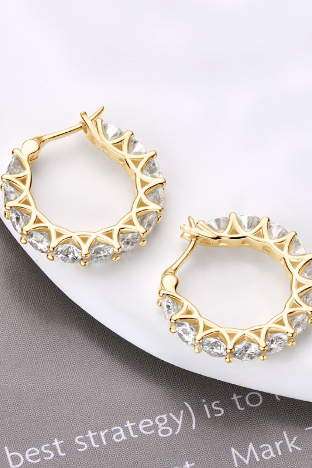 Sterling silver moissanite earrings with 7.2 carats, featuring sparkling round-cut stones in a stylish design.