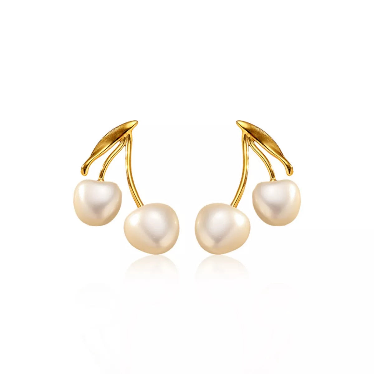 Pearl cherry drop earrings by Shopimist featuring white pearls and red cherry-shaped accents on silver hooks.