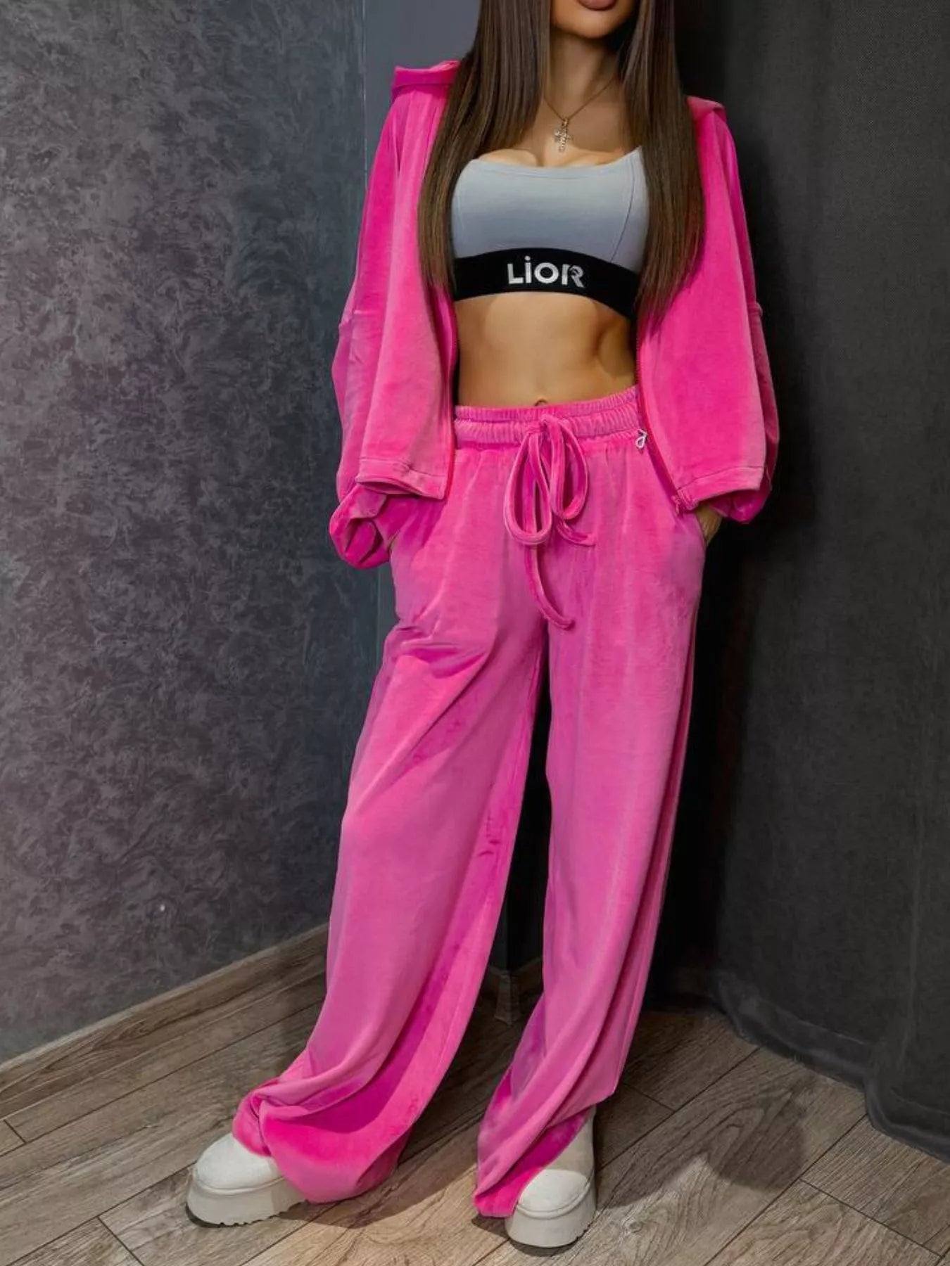 Plush Fashion Hub zip-up cropped outerwear and matching pants set, featuring a stylish, coordinated look in soft fabric.