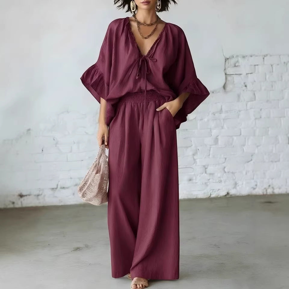 Women’s casual two-piece set with loose-fit V-neck top and wide-leg pants by FitiqueFit, shown in a comfortable, relaxed fit.