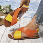 Women's color-block cross-strap flat sandals by FitiqueFit featuring vibrant straps and comfortable flat sole.