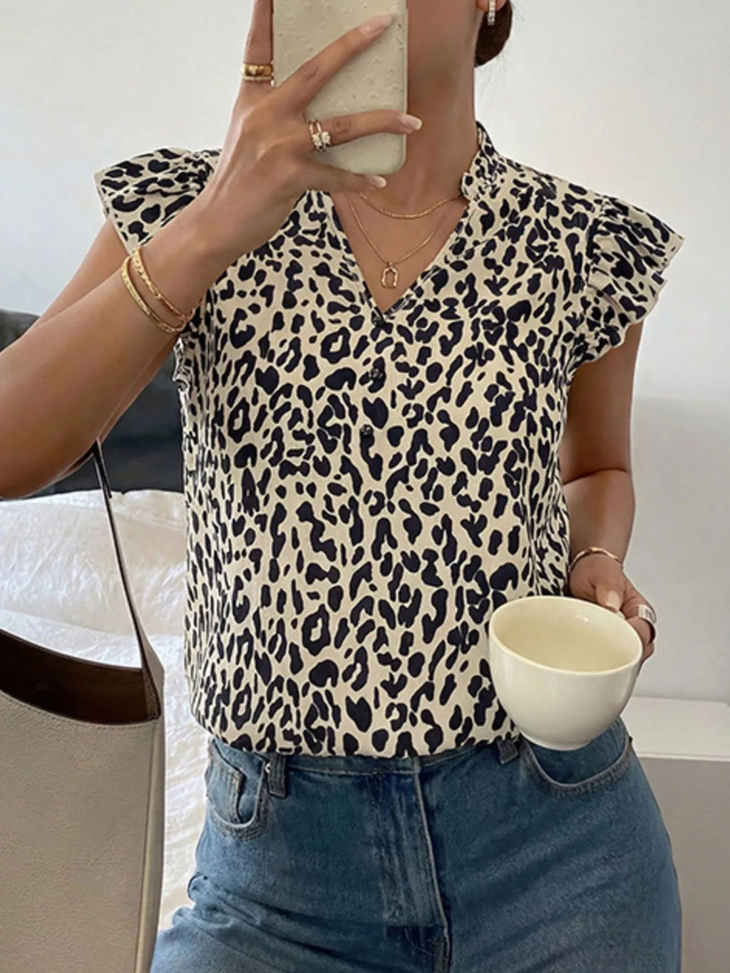 Leopard print ruffle sleeve blouse by Plush Fashion Hub, featuring bold animal print and stylish ruffle details.