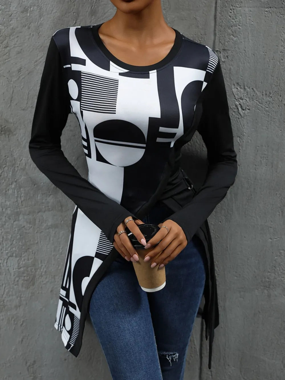 Trendy Perfee geometric round neck long sleeve T-shirt by Trendsi, featuring a modern design and comfortable fit.