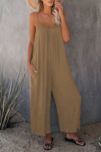 Women's pleated chest cross-strap jumpsuit by Plush Fashion Hub featuring a stylish design and tailored fit.