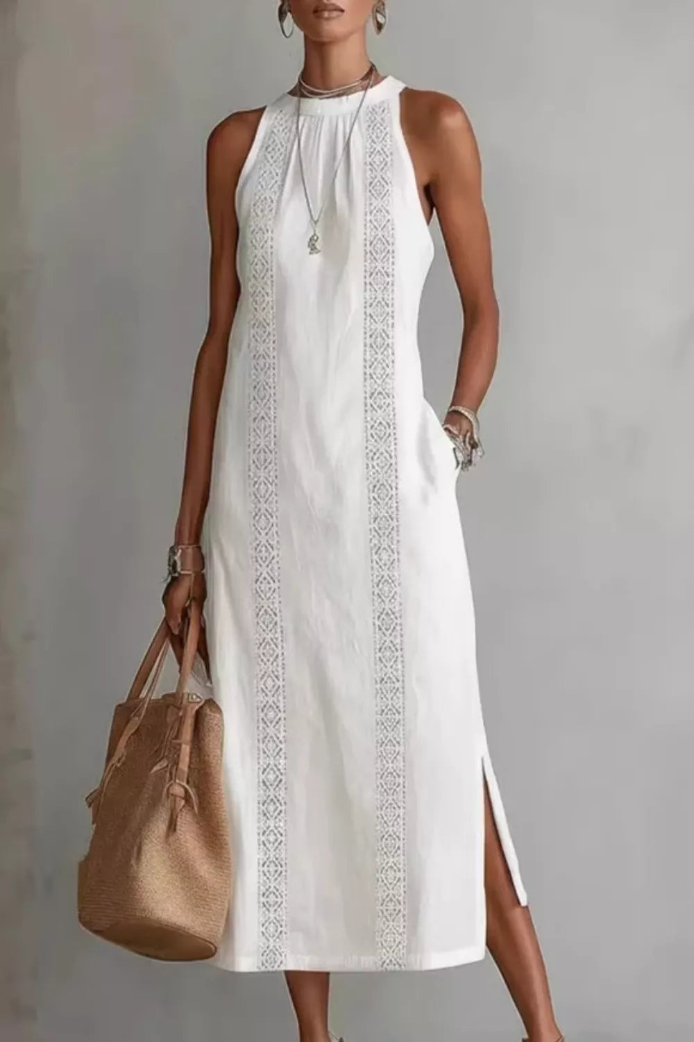 Women's sleeveless side slit maxi dress with pockets by Plush Fashion Hub, featuring a flowing design and comfortable fit.