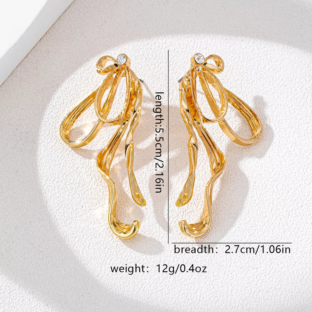 18K gold-plated bow earrings with delicate design, featuring shiny finish and elegant style, perfect for accessorizing.