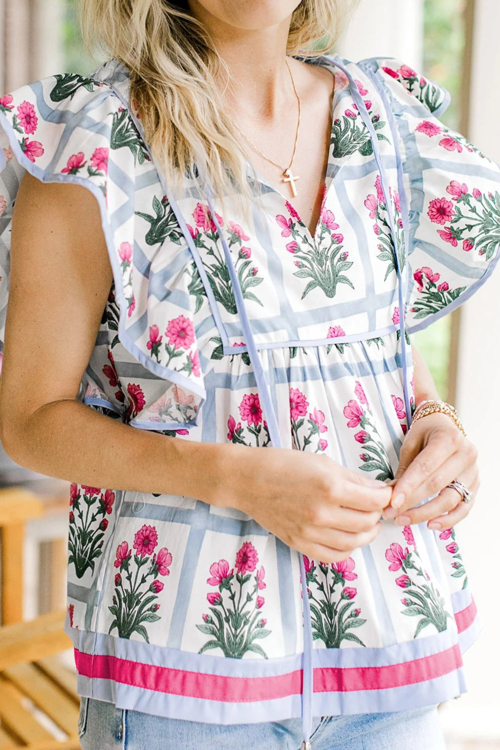 Women's floral print ruffle sleeve blouse with tied neckline, lightweight fabric, stylish top by Trendsi, perfect for casual wear
