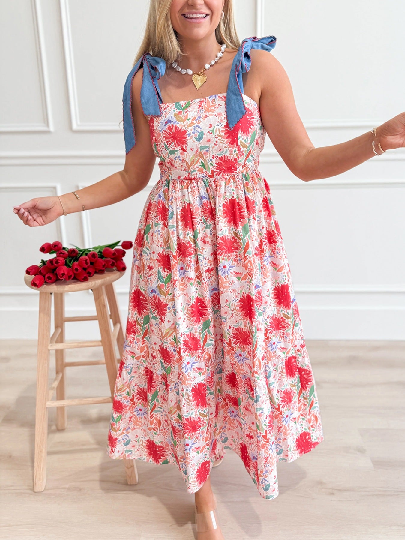 Floral print tie-shoulder midi dress by Trendsi featuring lightweight fabric, pockets, and a summery, feminine design.