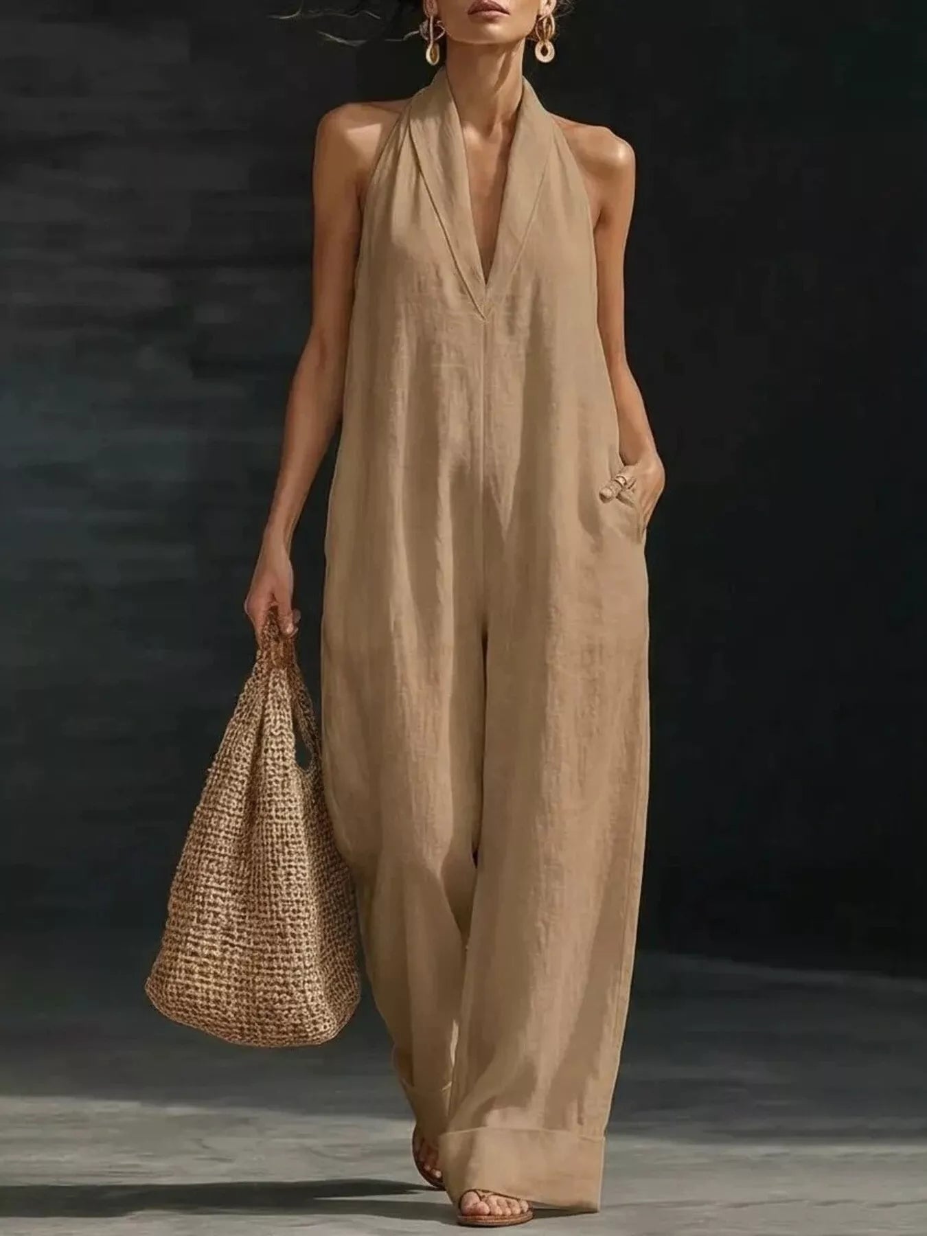Halter neck wide-leg jumpsuit by Trendsi featuring a stylish design, flowing fabric, and a modern silhouette for a chic look.