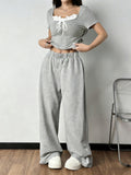 Shopimist tie front short sleeve top and matching pants set, stylish and casual outfit, shown in a relaxed fit.