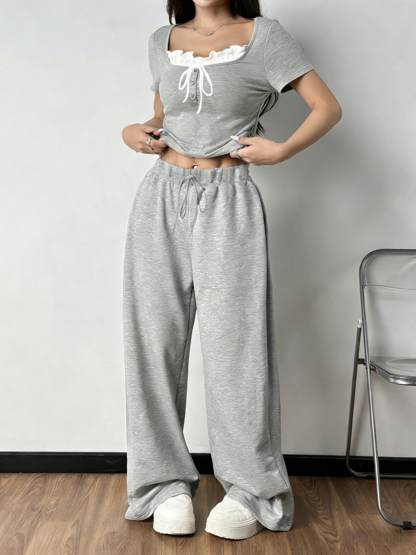 Plaid tie front short sleeve top and matching pants set by Plush Fashion Hub, casual two-piece outfit for women.