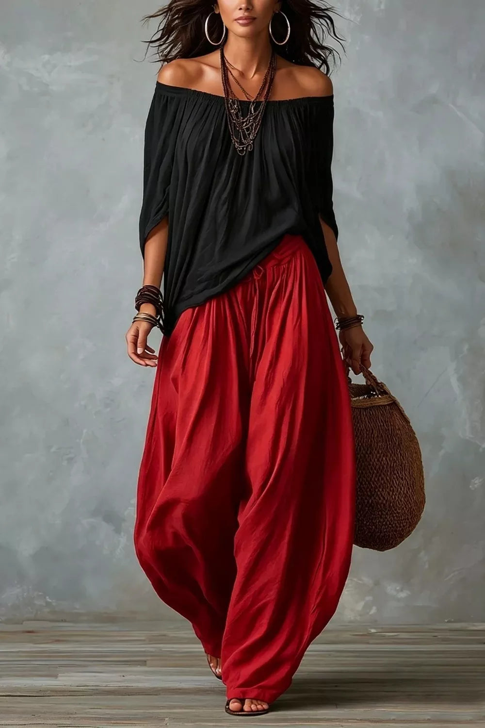 Plus size off-shoulder top and wide-leg pants set by Trendsi, featuring a stylish, comfortable matching outfit with flowing fabric.
