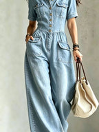Full size denim wide-leg jumpsuit with chest pockets, plus size trendy jumpsuit from Trendsi, displayed on a hanger.