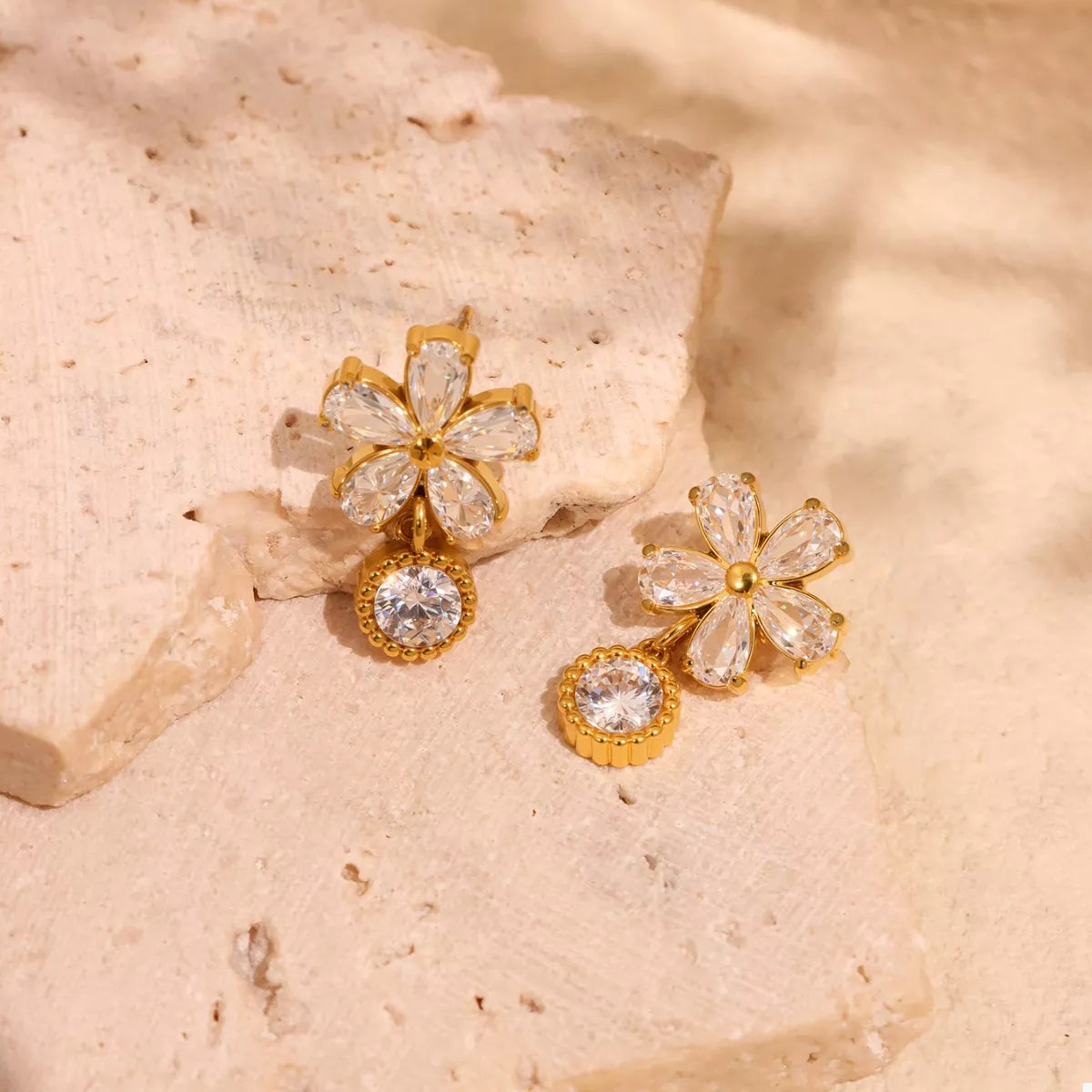 18K gold-plated stainless steel zircon flower drop earrings with intricate petal design and sparkling gemstone accents.