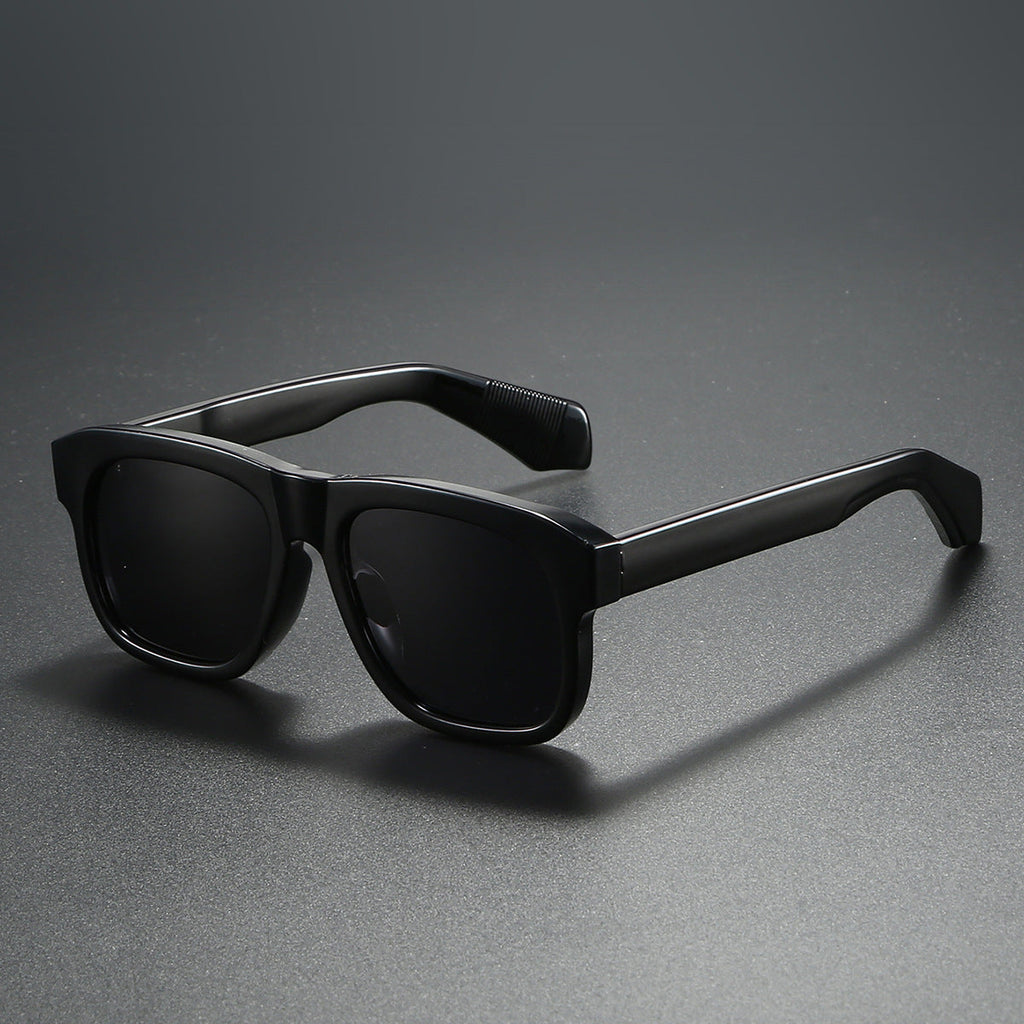 Unisex acetate-style polarized fashion sunglasses with a luxury look, featuring dark tinted lenses and stylish frame design.