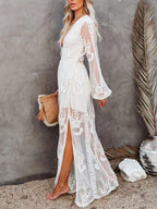 Elegant floral lace high-slit maxi dress by Trendsi, featuring intricate lace details and a flowing silhouette for formal evenings.
