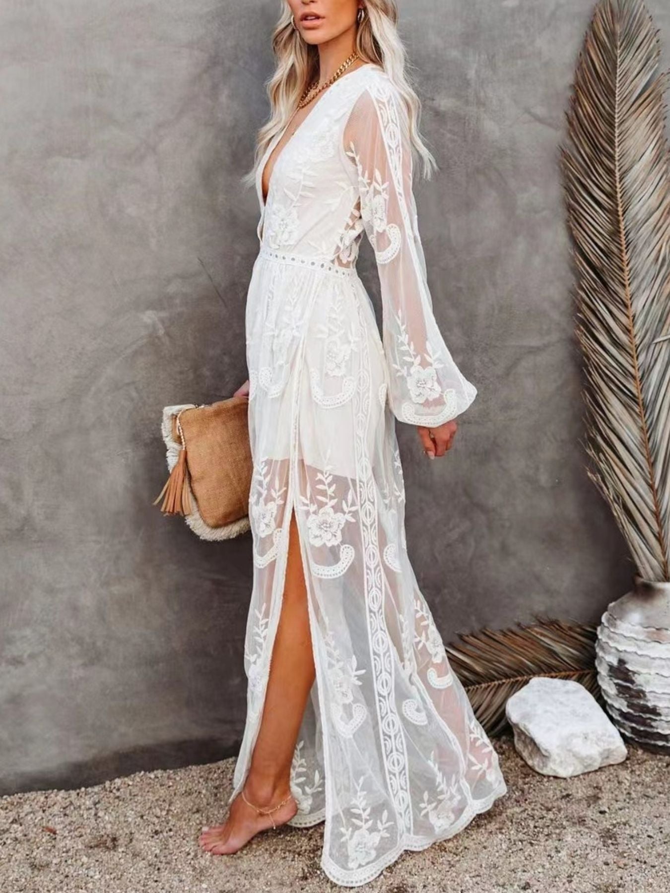 Elegant floral lace high-slit maxi dress by Trendsi, featuring intricate lace details and a flowing silhouette for formal evenings.