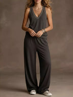 Plus size V-neck tank top and wide-leg pants set by Trendsi, featuring a stylish, comfortable matching outfit in soft fabric.