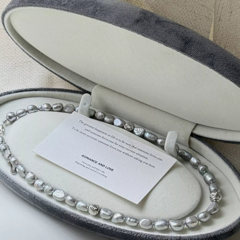 Elegant pearl choker necklace featuring lustrous white pearls and a delicate clasp, perfect for stylish accessories.