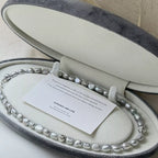 Elegant pearl choker necklace featuring lustrous white pearls and a delicate clasp, perfect for stylish accessories.