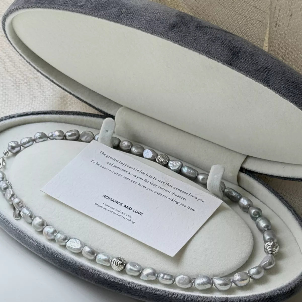 Elegant pearl choker necklace featuring lustrous white pearls and a delicate clasp, perfect for stylish accessories.