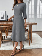 Classic plaid round neck midi dress with 3/4 sleeves, stylish and comfortable, by Trendsi.