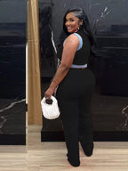 Zip front crop top and striped pants set by Shopimist, featuring a stylish crop top with a front zipper and matching striped pants.