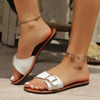 Open toe buckle sandals by Shopimist featuring stylish straps and a comfortable flat sole, perfect for casual summer wear.