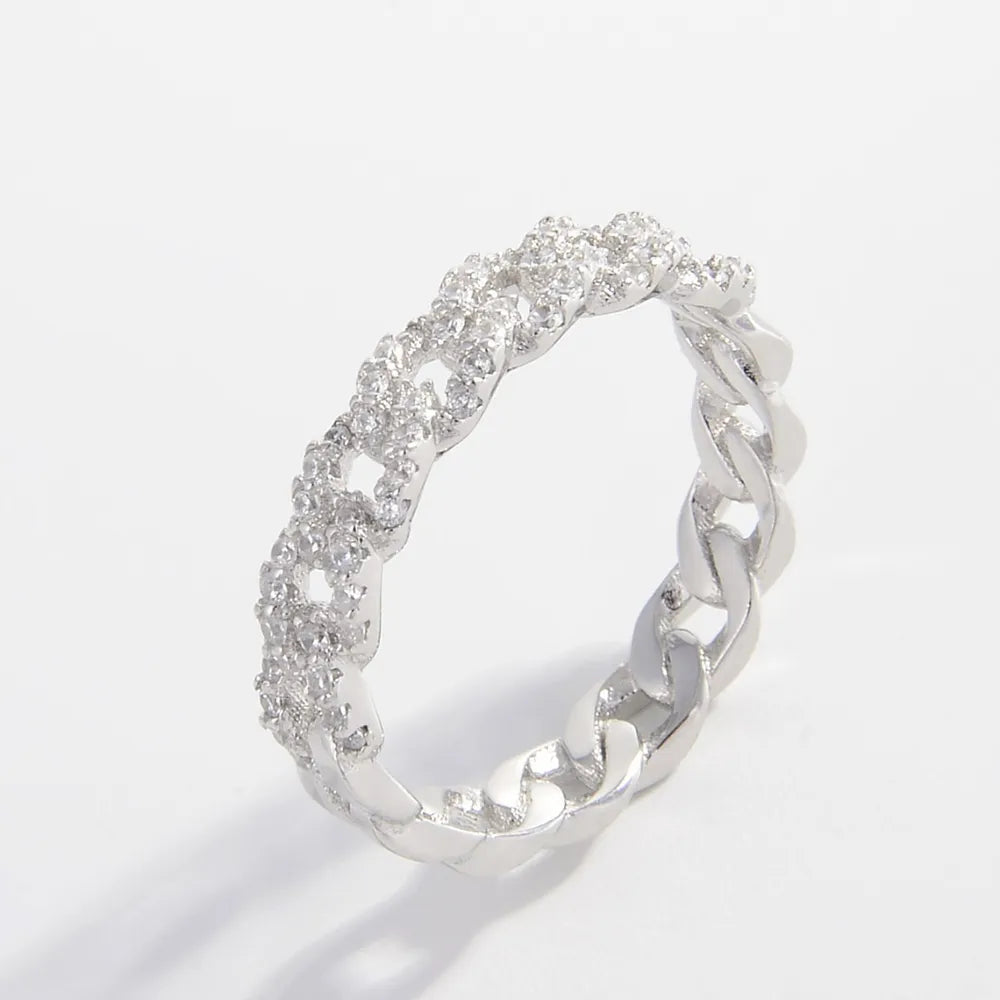 925 sterling silver inlaid zircon ring featuring a polished band and sparkling zircon stones, showcasing elegant jewelry craftsmanship.