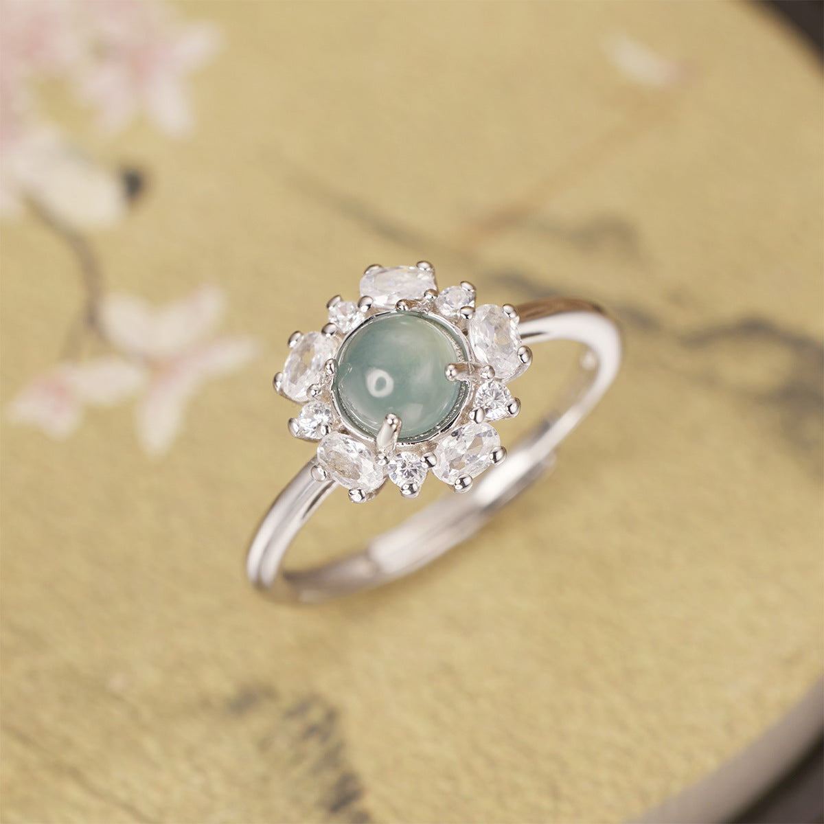 925 Sterling Silver Jadeite Ring featuring a vibrant green jadeite gemstone and intricate silver band design.