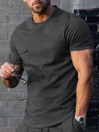 Men's plus size casual T-shirt in solid color, Trendsi brand, displayed as a comfortable, everyday tops option.