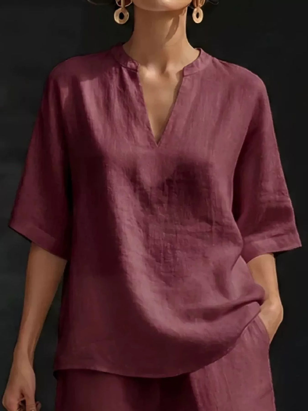 Plus size Trendsi notched half sleeve top and shorts set, featuring a stylish, comfortable matching outfit in the image.