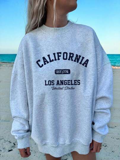 Women's cute kitten graphic sweatshirt from Plush Fashion Hub, featuring a cozy streetwear style with a playful kitten design.