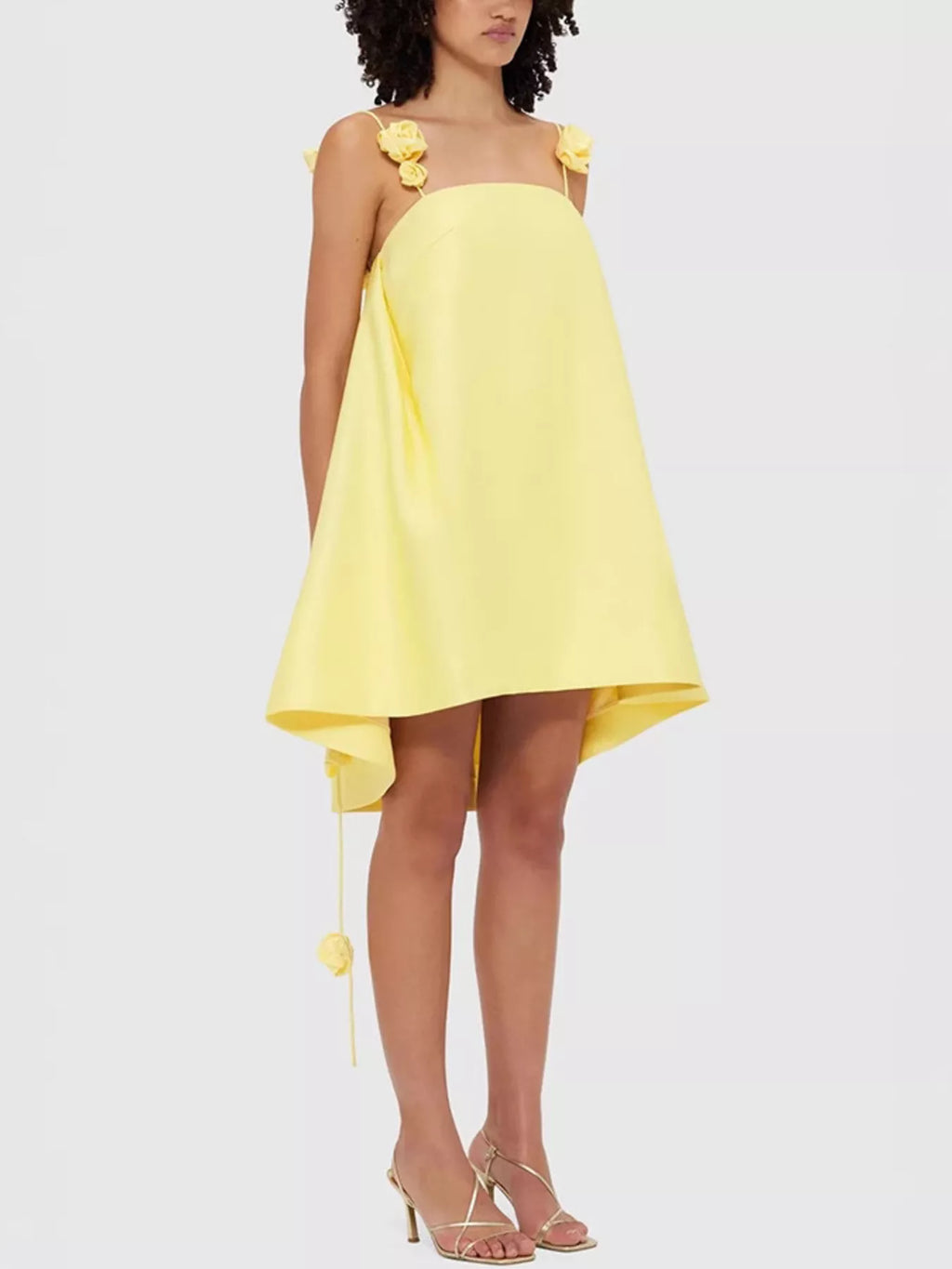 Floral strap mini A-line dress from Trendsi featuring a fitted bodice, flared skirt, and vibrant floral print.