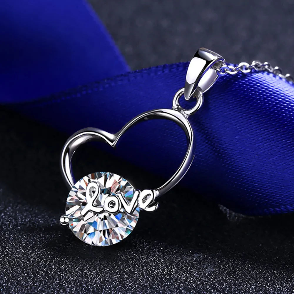 Sterling silver heart necklace with 2 carat moissanite gemstone, elegant jewelry piece with a sparkling heart-shaped pendant.